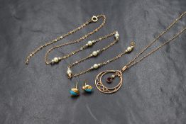 A 9ct gold Edwardian garnet and seed pearl set necklace, the circular openwork pendant having a