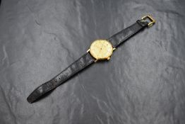 A gent's 1970's manual wind Longines wrist watch, having a baton numeral dial with dark blue steel