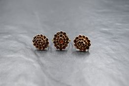 A pair of Czechoslovakian 900 silver gilt garnet set screw back earrings, along with a matching