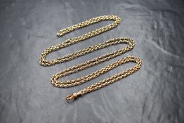 A yellow metal belcher link muff chain, no marks but tests as 9ct gold, approx 56' long & 33g