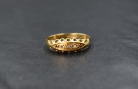 A Victorian 18ct gold 5 stone diamond chip ring having 5 pave set stones in a boat set mount on an