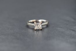 An 18ct white gold diamond set solitaire ring, the princess cut diamond measuring approximately 1.