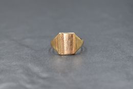 A 9ct gold signet ring the rectangular panel having decorative herringbone engraving marked 375 ring