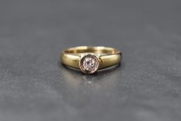 A 14ct gold diamond solitaire ring having a brilliant cut diamond, approx 0.25ct in a collared