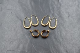Three pairs of 9ct gold loop & hoop earrings of plain and moulded form, approx 4.3g