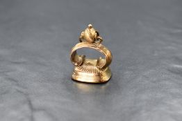 A yellow metal fob having an agate shield intaglio, no marks tests as 15ct gold, approx 14.5g gross