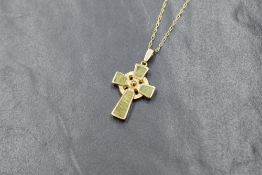 A 10ct gold green marble set Celtic cross, having Celtic knot decoration to the reverse, marked 417,