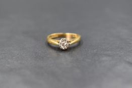 An 18ct gold diamond solitaire ring having a brilliant cut diamond, approx 0.25ct in an