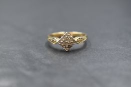 A 9ct gold diamond square cluster ring having sixteen small diamond chips in a pave set square mount
