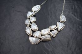 A Chris Lewis silver mother-of-pearl set statement necklace, the articulated silver panels having