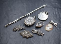 A selection of silver jewellery including a Victorian locket having engraved fern decoration and