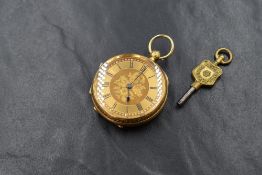 A late Victorian 18ct gold open face key wound pocket watch, the golden dial having floral