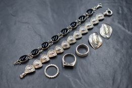 A small selection of silver jewellery including an Artisan style articulated bracelet having