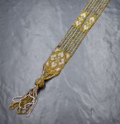 A belle epoque beaded sautoir necklace having gold and silver coloured metal beaded strands