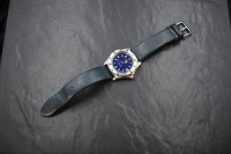 A Tag Heuer Professional wristwatch, the navy blue dial having baton and Arabic numerals with date