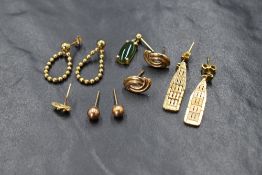 Four pairs of 9ct gold/yellow metal earrings plus two odd earrings, approx 9g gross