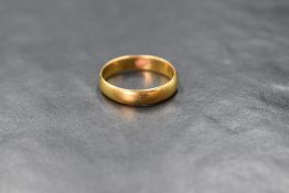 A yellow metal wedding band of plain form, no hallmarks but tests as 22ct gold, size S/T & approx
