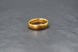 A 22ct gold band, of plain rounded form, marked 22 with hallmarks, ring size L, 4.5g