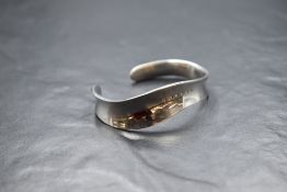 A silver Hot Diamonds tension bangle having six small inset diamonds, approx 27.2g