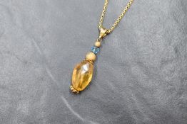 An 18ct gold chain with 18ct gold citrine bead attachment pendant, chain approx 16' and 3.5g exclud