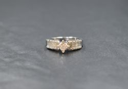 A 14ct white gold diamond set cluster ring, the central square cluster having sixteen pave set