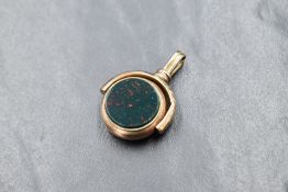 A rose gold swivel fob stamped 9ct having blood stone and chalcedony panels, approx 6.5g gross,