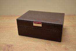 A Stackers two layer brown jewellery box having pink and orange interior