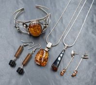 A large silver amber set cuff bracelet, of a floral openwork design, along with a silver amber set