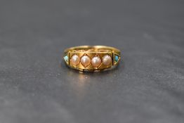 An 18ct gold pearl and turquoise set ring, the central four split pearls within a decorative border,
