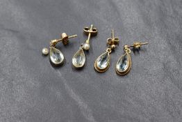 Two pairs of yellow metal and 9ct gold earrings both having aqua style drops, one pair havig seed