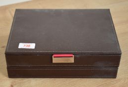A two layer brown Stackers jewellery box having pink and turquoise interiors