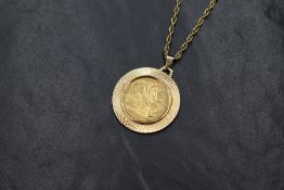 A Victorian 1887 sovereign in a 9ct gold pendant mount, having decorative engraving, on a 9ct gold