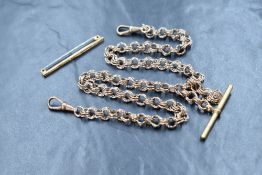 A yellow wire triple loop link watch chain with T bar, does not test as gold, approx 26.7g, and a