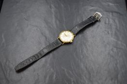 A gent's vintage gold plated Zenith manual wind wrist watch having Arabic numeral and baton dial