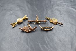 A 10ct gold Yukon gold mining motif brooch, the central 'Yukon' upon a bar within a half crescent