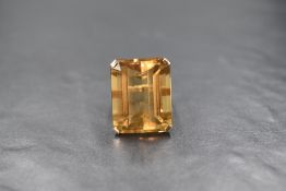 An impressive 9ct gold citrine set ring, the emerald cut citrine measuring approximately 24mm x 20mm