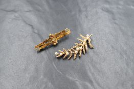 A 9ct gold cultured pearl set brooch, the fern motif brooch set with ten cultured pearls, marked