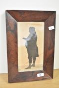 A Victorian Silhouette portrait of a man, full length, rosewood framing, having a faint