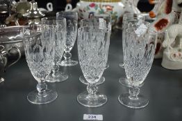 A group of nine Waterford crystal wine glasses, of flute form cut with repeating hobnail and