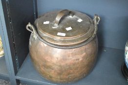 A large 19th-century copper, brass and cast iron lidded hanging pan of traditional design. Lid