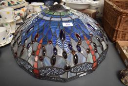 A large modern leaded and stained glass Tiffany style lamp shade, of domed circular form decorated