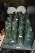A collection of 21 20th-century Codd-neck bottles, featuring examples marked 'H&F Baxter, Lancaster'