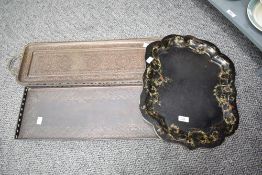 An unusual Arts & Crafts copper tray, of oblong form with slightly raised and pierced edge with