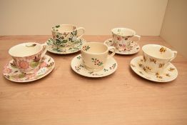 A mixed group of five Emma Bridgewater cups and saucers, mixed designs including Bumblebee, Sweet