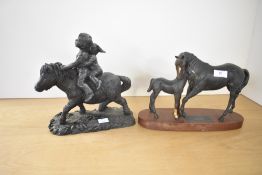A late-20th century Beswick model of 'Black Beauty & Foal', having an oval wooden base, sold