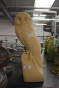 A contemporary Tony Ladd Art cast portland stone-style, life-sized barn owl statue, in the style
