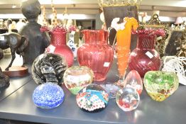 A collection of twelve mid-century modern studio glass, featuring a pair of cranberry swirl optic