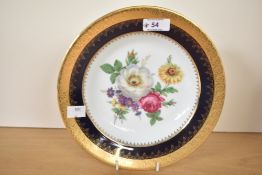 A Limoges porcelain plate hand painted with floral patterns, w23.5cm