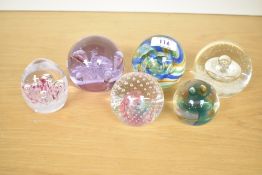 A selection of six Caithness Scotland studio art glass paperweights, featuring 'Twirl', 'Reflections