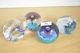 A selection of four Caithness Scotland studio art glass paperweights, featuring 'Splashdown', '